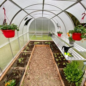 ClimaPod Arched 9x14 Complete Greenhouse Kit interior display photo with red flowerpots