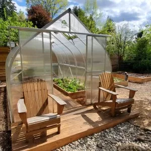 ClimaPod 9x14 Greenhouse Kit customer photo with wooden chairs